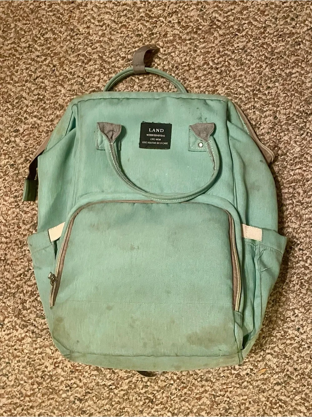 Mint Green Canvas Backpack with Top Handle and Front Pocket